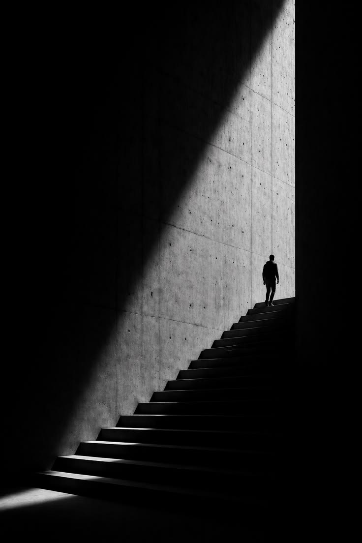 Placeholder: a figure climbing concrete stairs into light